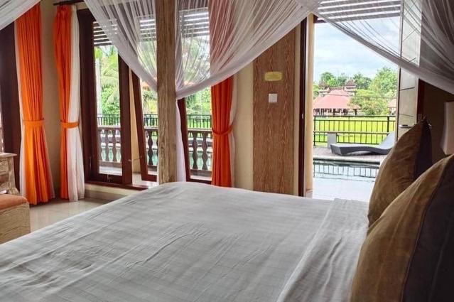 Postel nebo postele na pokoji v ubytování Gefecon Villa Ubud