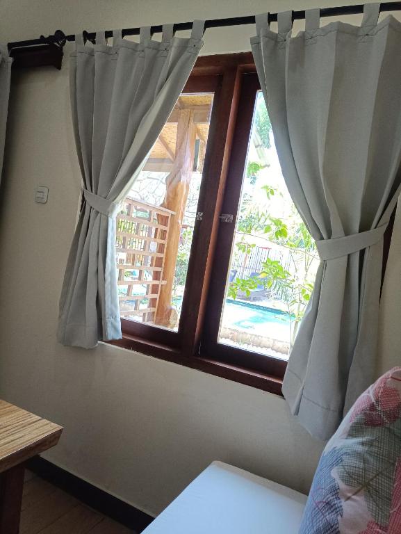 Postel nebo postele na pokoji v ubytování Villa Kinagu
