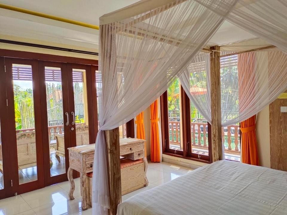 Postel nebo postele na pokoji v ubytování Gefecon Villa Ubud