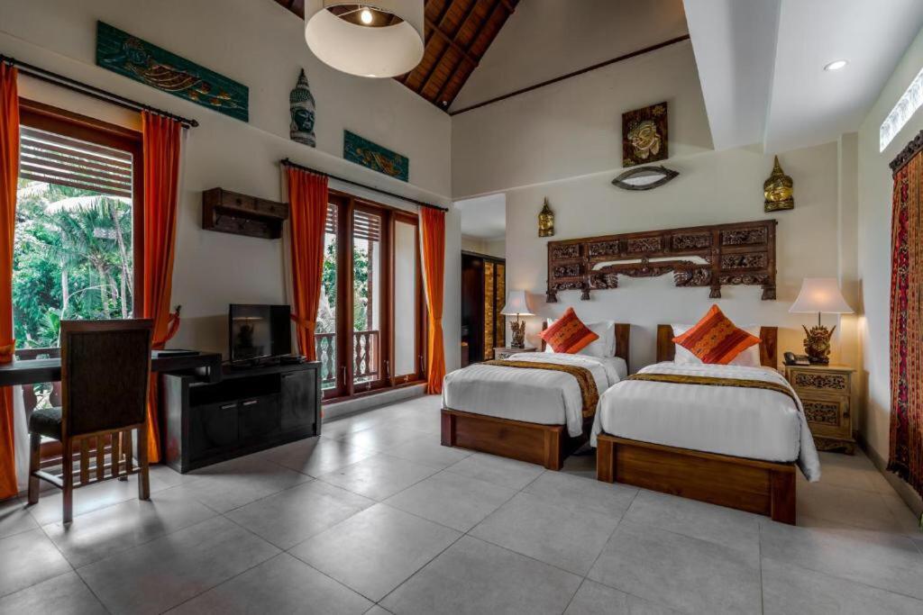 Postel nebo postele na pokoji v ubytování Gefecon Villa Ubud