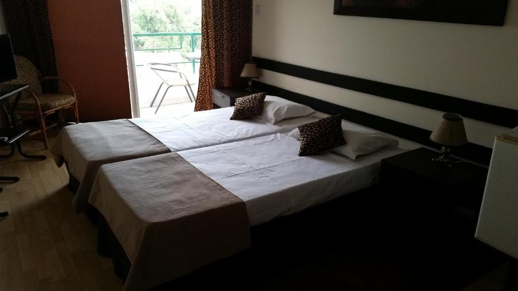 Postel nebo postele na pokoji v ubytování Sylva Hotel