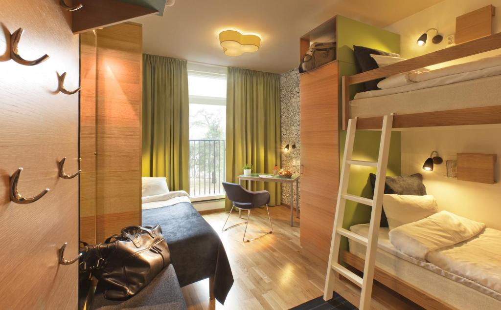 Postel nebo postele na pokoji v ubytování Bosön Hotell & Konferens