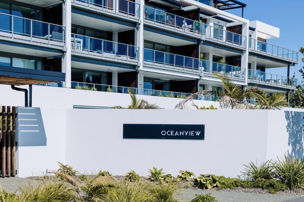 an apartment building with a sign that reads oceanview at Oceanview Retreat in Nelson