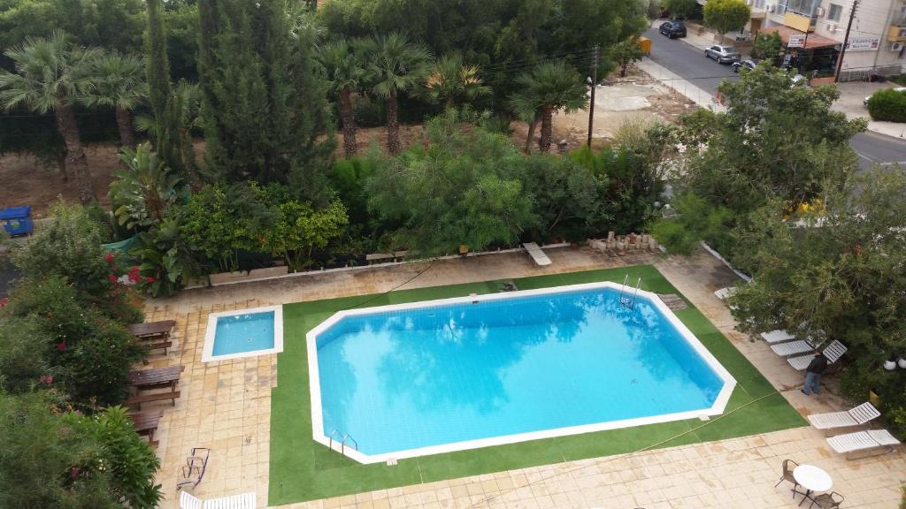 an overhead view of a large blue swimming pool at Sylva Hotel in Limassol