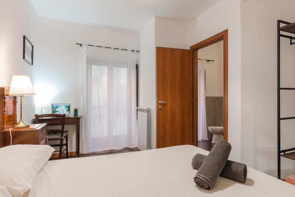 Postel nebo postele na pokoji v ubytování Le Luci su Ibla - Ospitalità con vista