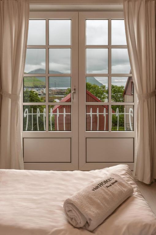 Postel nebo postele na pokoji v ubytování visitHOMES Faroe Islands