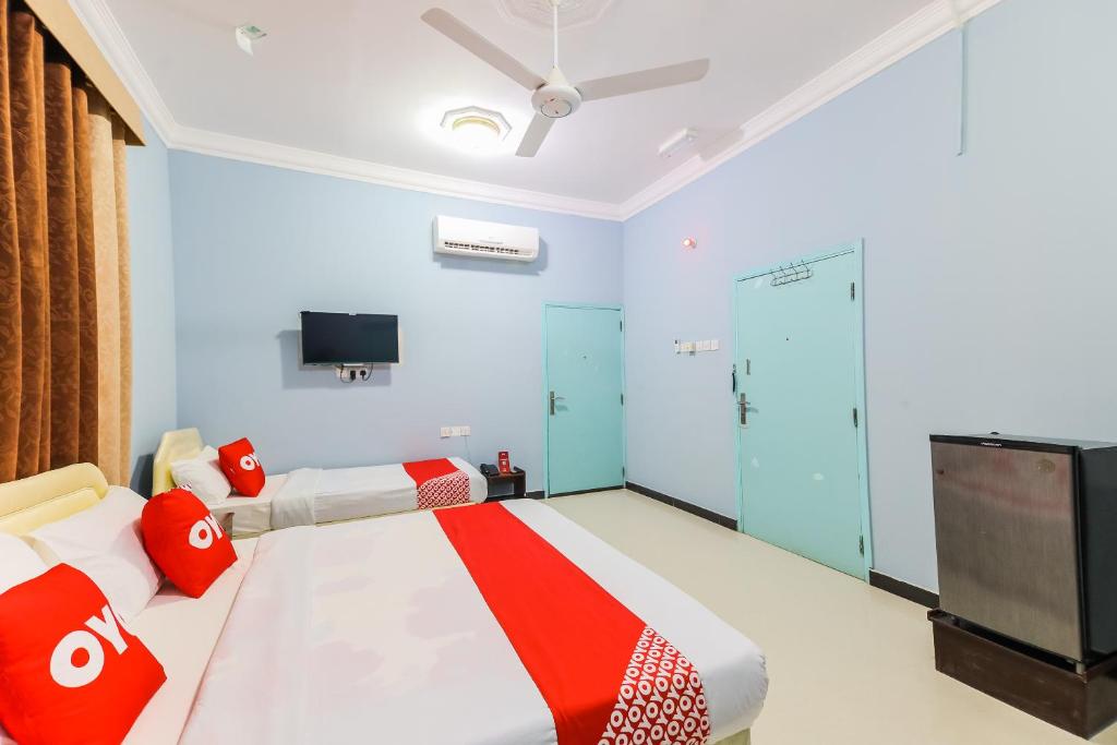 Postel nebo postele na pokoji v ubytování Super OYO 110 Ras Al Hadd Guest House