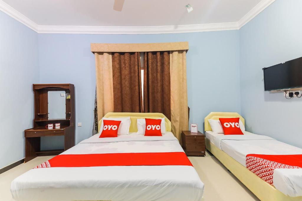 Postel nebo postele na pokoji v ubytování Super OYO 110 Ras Al Hadd Guest House