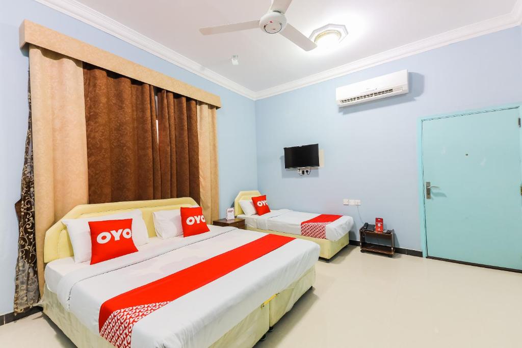 Postel nebo postele na pokoji v ubytování Super OYO 110 Ras Al Hadd Guest House