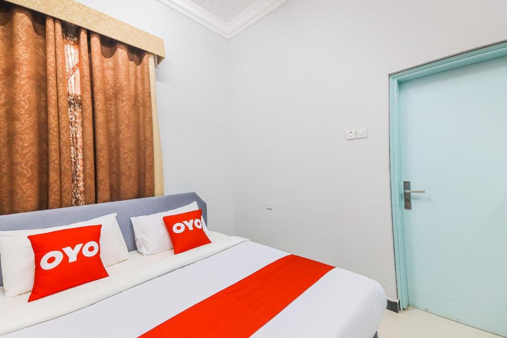 Postel nebo postele na pokoji v ubytování Super OYO 110 Ras Al Hadd Guest House