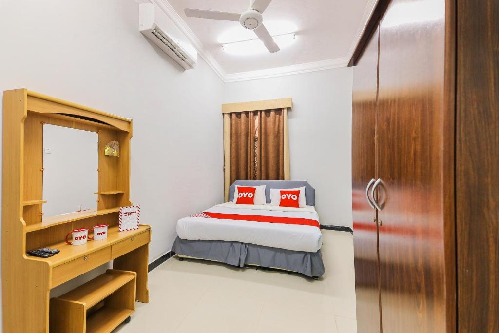 Postel nebo postele na pokoji v ubytování Super OYO 110 Ras Al Hadd Guest House