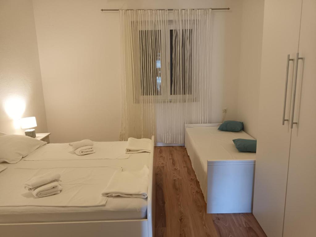 Postel nebo postele na pokoji v ubytování Apartments Verica