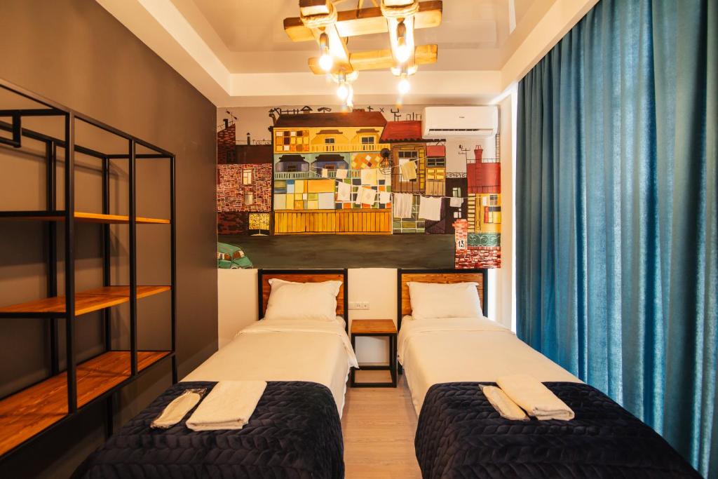 Postel nebo postele na pokoji v ubytování Hotel Boutique George