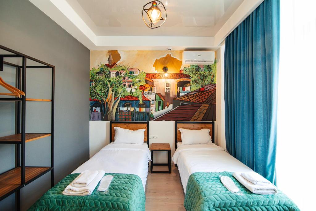 Postel nebo postele na pokoji v ubytování Hotel Boutique George