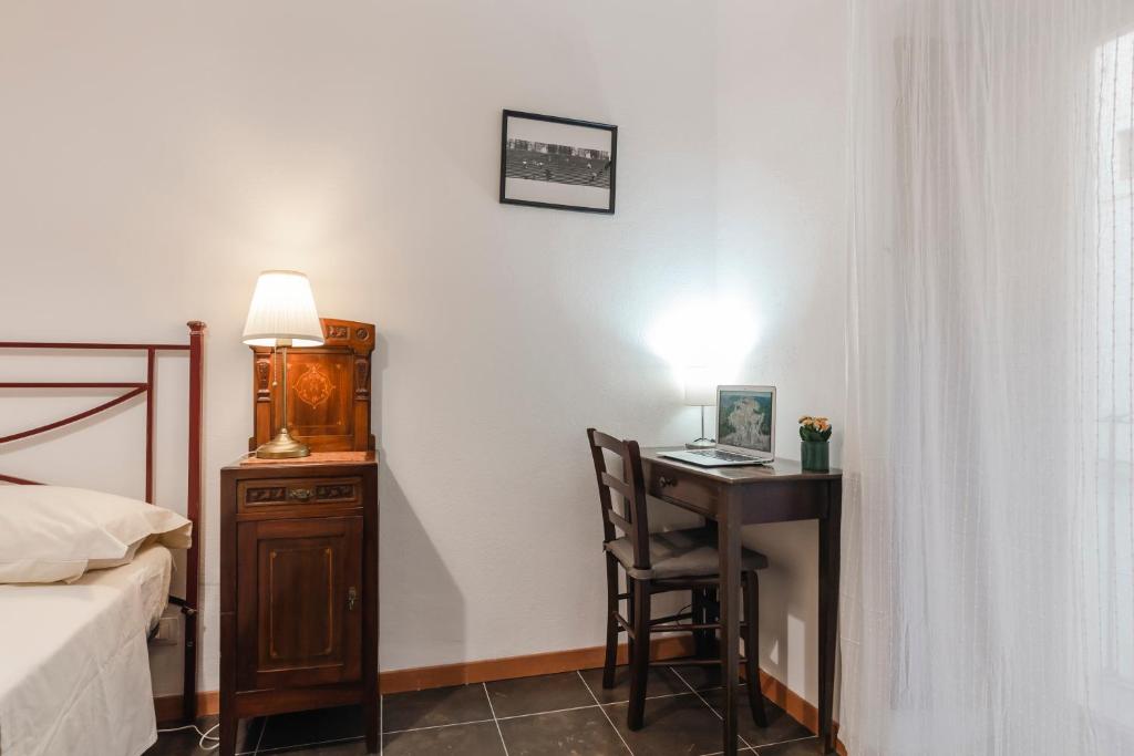 Postel nebo postele na pokoji v ubytování Le Luci su Ibla - Ospitalità con vista