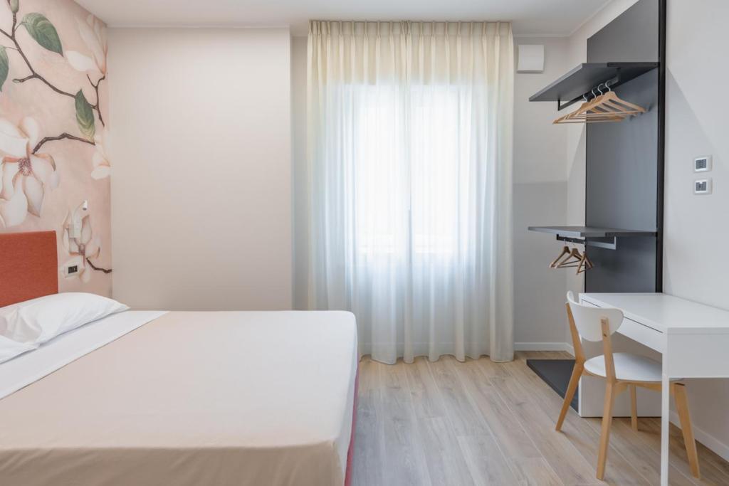 Postel nebo postele na pokoji v ubytování Albergo Degli Amici