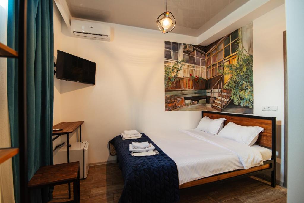 Postel nebo postele na pokoji v ubytování Hotel Boutique George