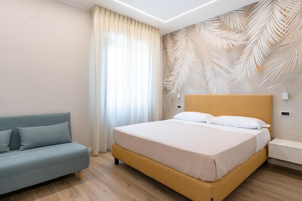 Postel nebo postele na pokoji v ubytování Albergo Degli Amici