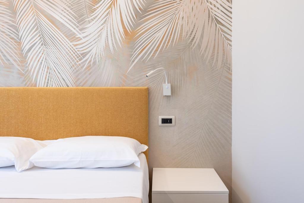 Postel nebo postele na pokoji v ubytování Albergo Degli Amici
