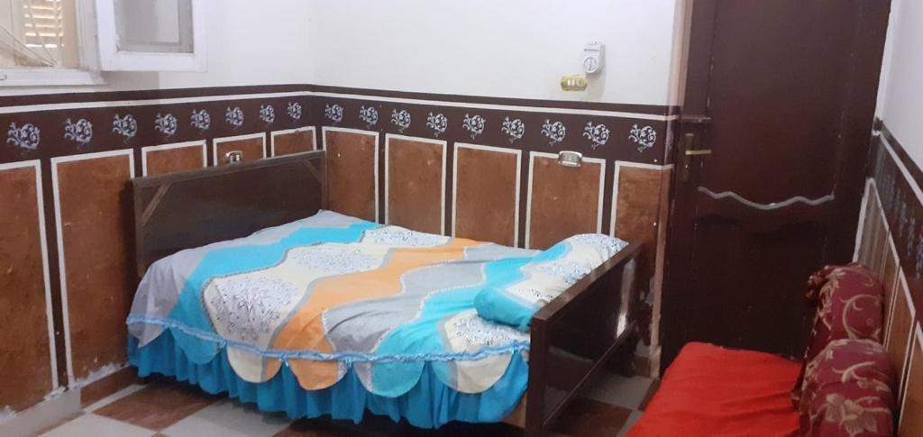 En eller flere senge i et værelse på Village Room in the Countryside