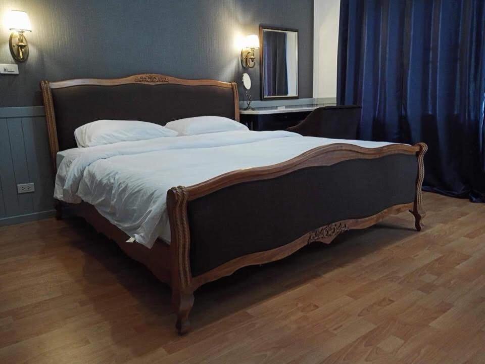 Postel nebo postele na pokoji v ubytování Baan JaoKorKluay บ้านเจ้ากอกล้วย