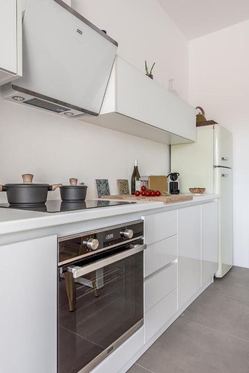 Kuchyňa alebo kuchynka v ubytovaní Elyos Apartments