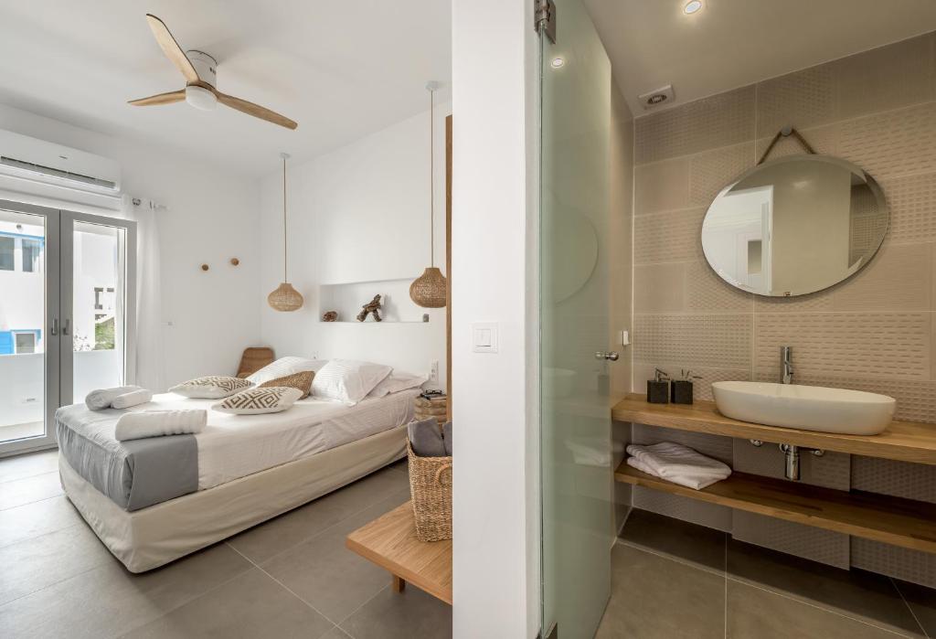 Posteľ alebo postele v izbe v ubytovaní Elyos Apartments