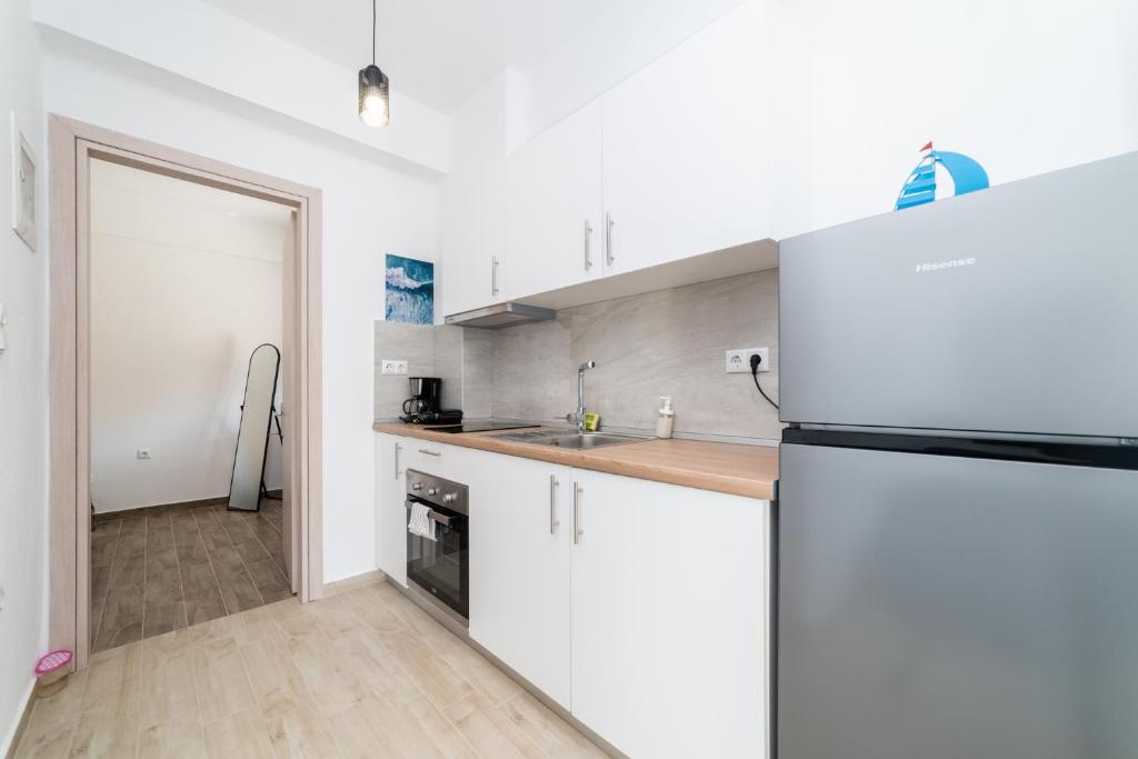 Kuchyň nebo kuchyňský kout v ubytování Danai & Palm Residential Complexes