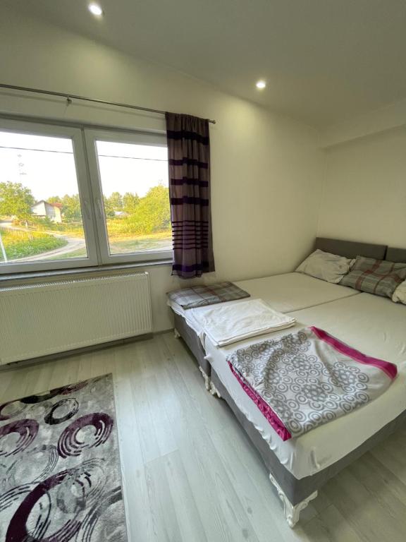 Katil atau katil-katil dalam bilik di Apartment Azra