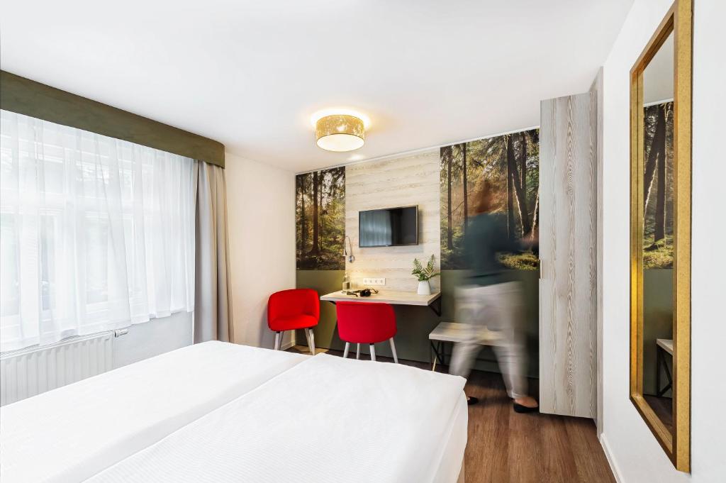 TV a/nebo společenská místnost v ubytování Hotel Forsthaus