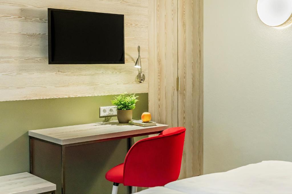 TV a/nebo společenská místnost v ubytování Hotel Forsthaus