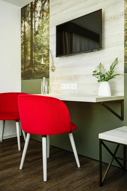 TV a/nebo společenská místnost v ubytování Hotel Forsthaus
