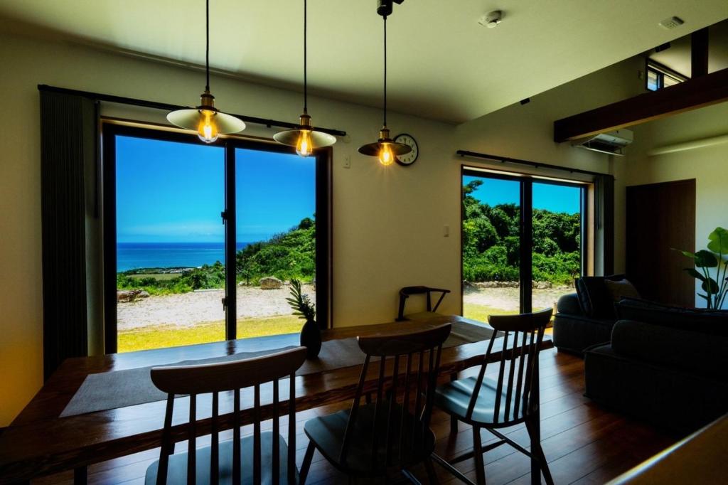 a living room with a view of the ocean at 山里の家 in Nanjo