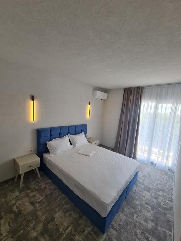 Postel nebo postele na pokoji v ubytování Mojo Resort