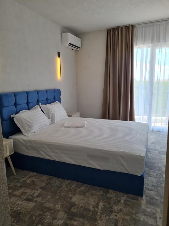 Postel nebo postele na pokoji v ubytování Mojo Resort