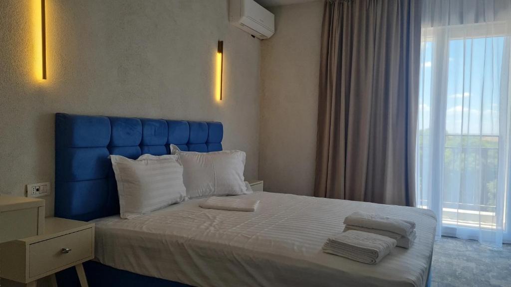 Postel nebo postele na pokoji v ubytování Mojo Resort