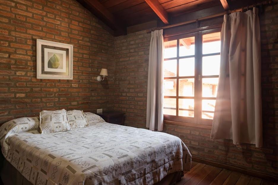 Postel nebo postele na pokoji v ubytování Cabañas El Eden Spa