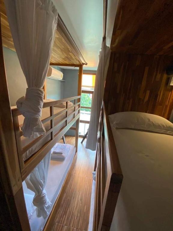 a pair of bunk beds in a room at Bloom Cafe & Hostel in Ko Lipe