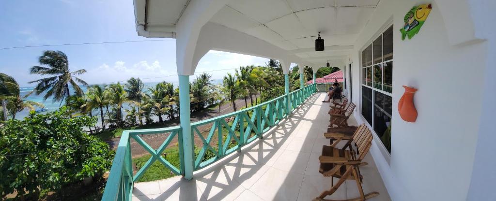 a balcony of a house with a view of the ocean at Ocean View in Big Corn Island