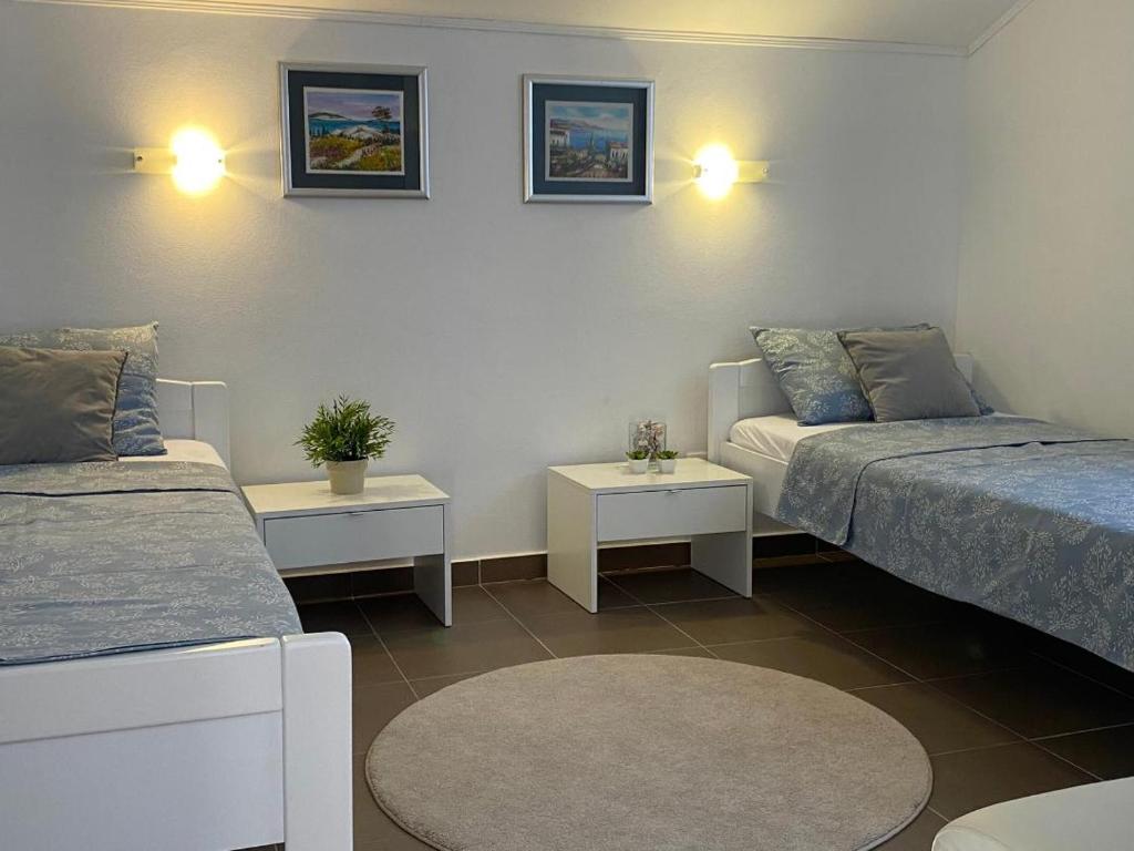 Postel nebo postele na pokoji v ubytování Adria apartmani