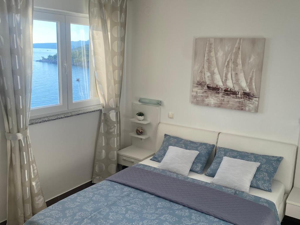 Postel nebo postele na pokoji v ubytování Adria apartmani