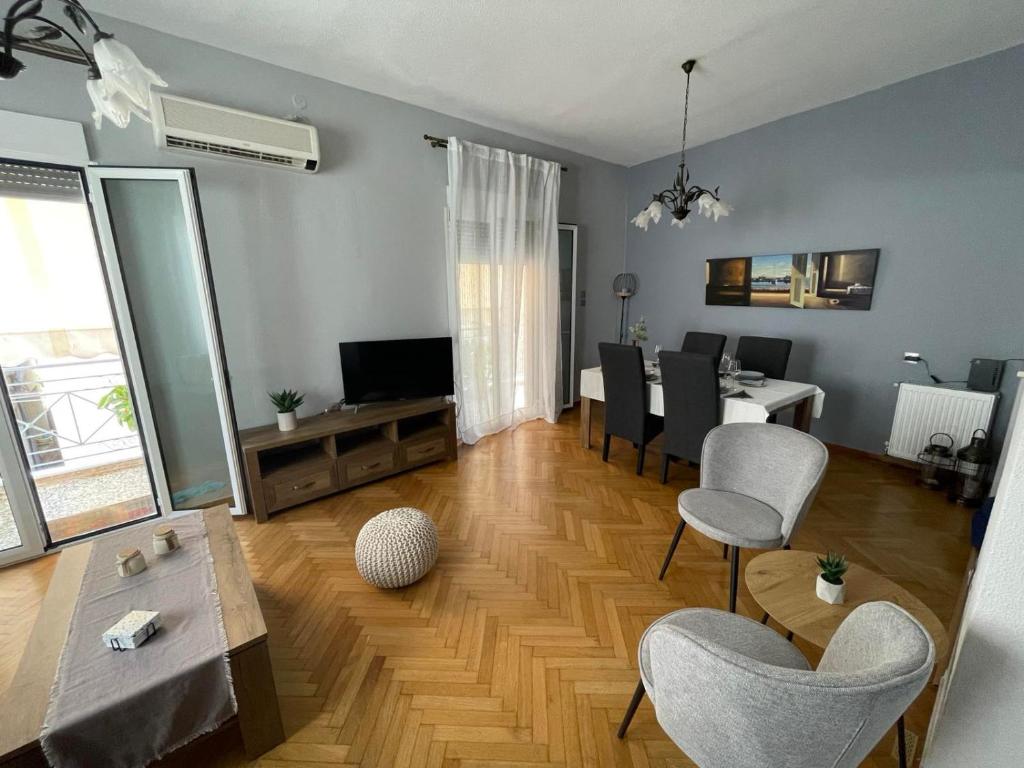 Televízia a/alebo spoločenská miestnosť v ubytovaní Myrtia Home