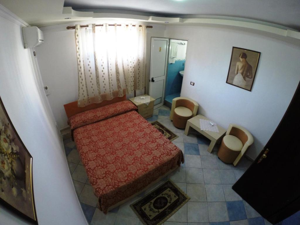 Postel nebo postele na pokoji v ubytování Hotel Ideal