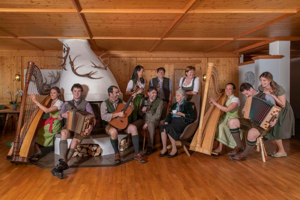 a group of people sitting in a room with instruments at Chalet Waldhaus Rappakopf in Schruns