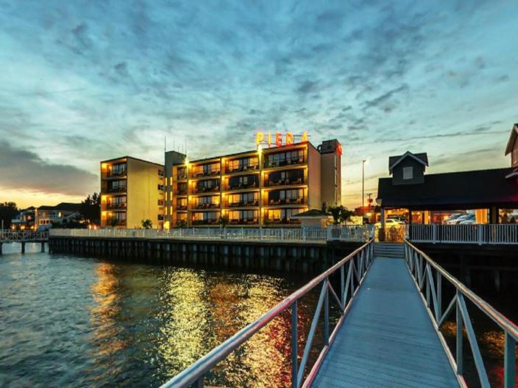 a building next to a body of water at Pier 4 Hotel in Somers Point