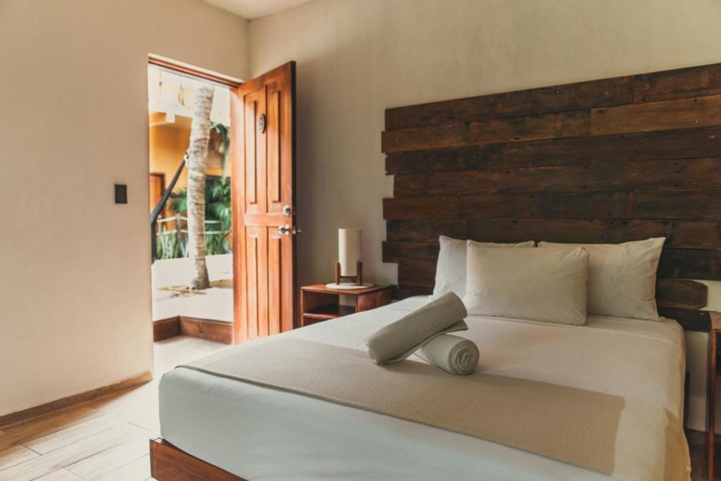 Postel nebo postele na pokoji v ubytování Hotel Sur Bacalar
