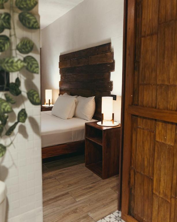 Postel nebo postele na pokoji v ubytování Hotel Sur Bacalar
