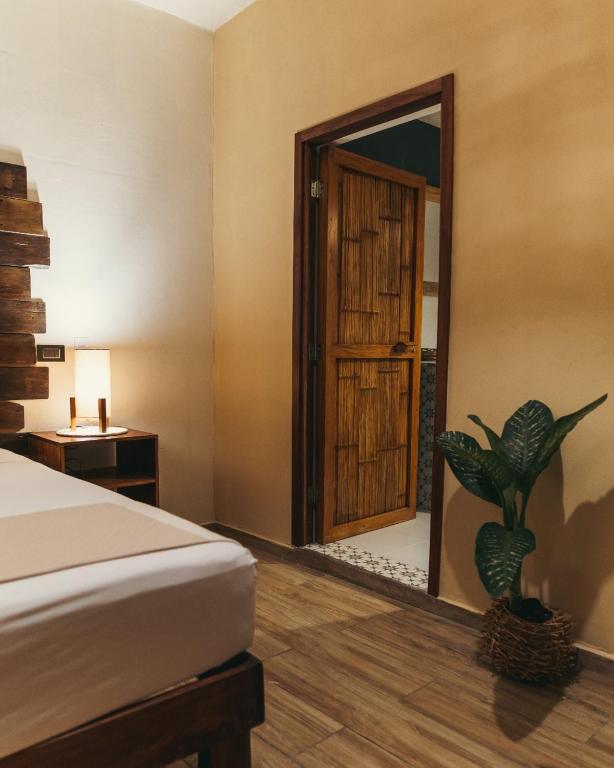 Postel nebo postele na pokoji v ubytování Hotel Sur Bacalar