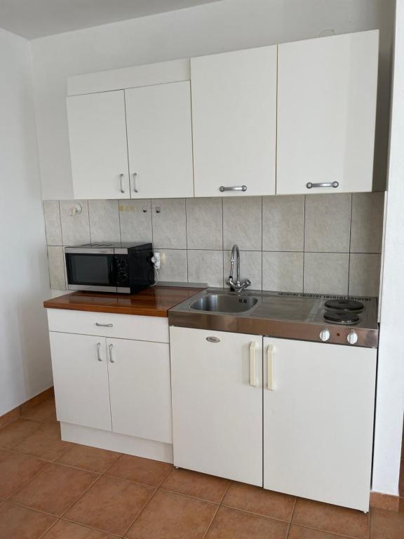 Kuchyňa alebo kuchynka v ubytovaní Melita Apartements