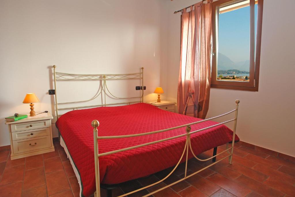 Postel nebo postele na pokoji v ubytování B&B Agli Ulivi